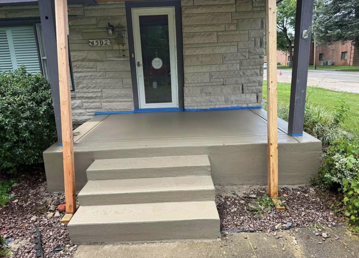 Front porch after: new concrete steps and slab finished by B&T