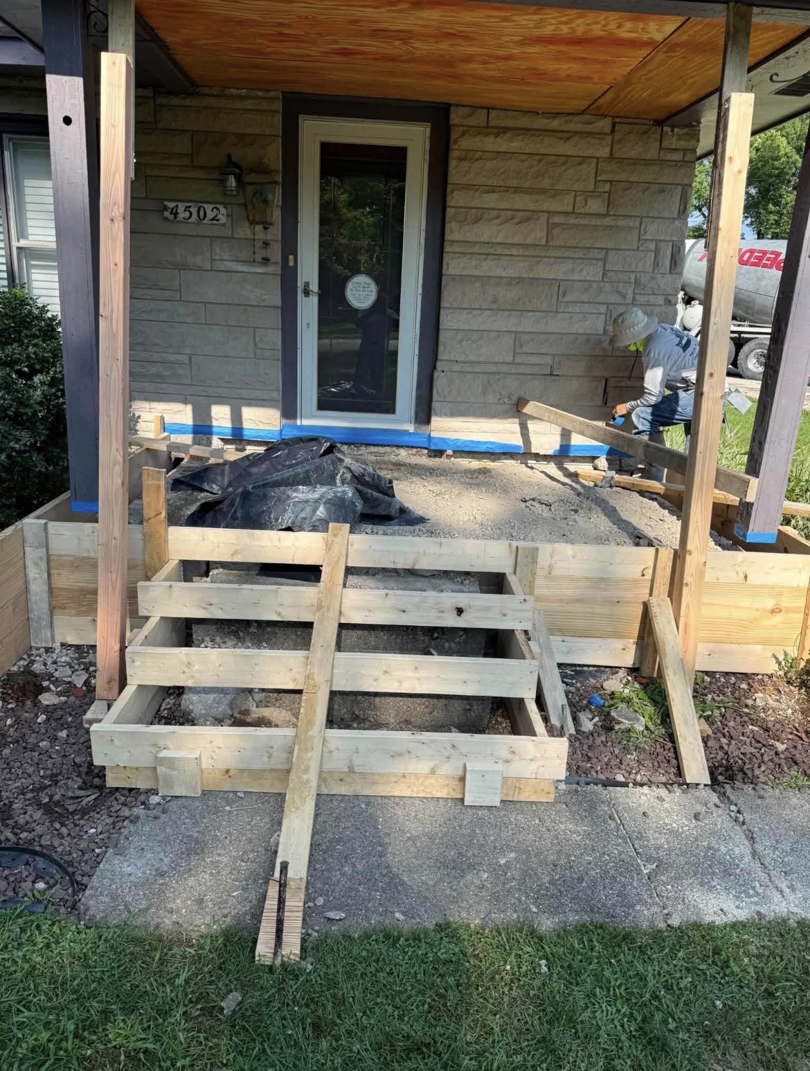 Front porch before: concrete forms staged for the pour