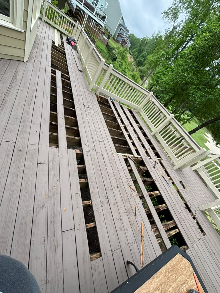 Deck before: worn boards removed down to the joists